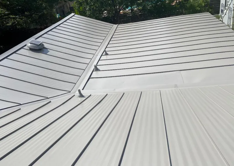 Solar attic fan installed on a metal roof for Roof Ventilation in McAlester